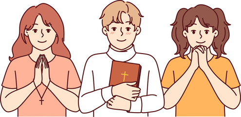 Children sunday school students make prayer gestures and hold holy bible or christian crosses in hands. Christian children from catholic or orthodox fold learn to perform religious rituals