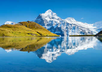 Bachalpsee, Grindelwald, Switzerland. High mountains and reflection on the surface of the lake....