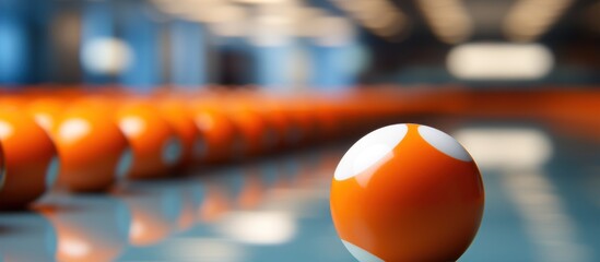 Orange billiard balls in a row. - obrazy, fototapety, plakaty