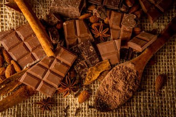 overhead shot of various spiced chocolate presentations on a rustic background
