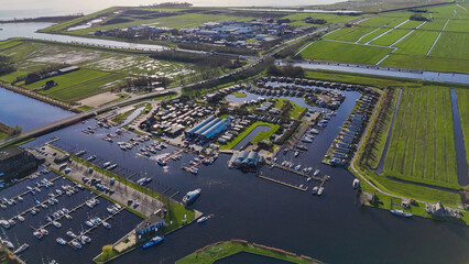 Aerial drone view geometric pattern of water houses, marina, yachts Marina Park Lemmer Netherlands