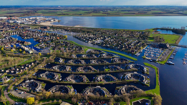 Aerial drone view geometric pattern of water houses, marina, yachts Marina Park Lemmer Netherlands
