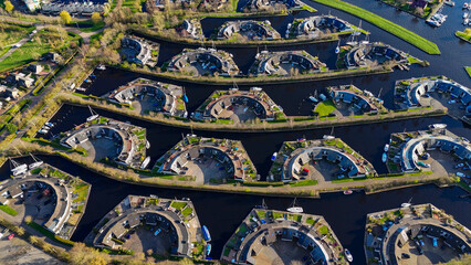 Aerial drone view geometric pattern of water houses, marina, yachts Marina Park Lemmer Netherlands