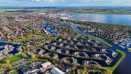 Aerial drone view geometric pattern of water houses, marina, yachts Marina Park Lemmer Netherlands