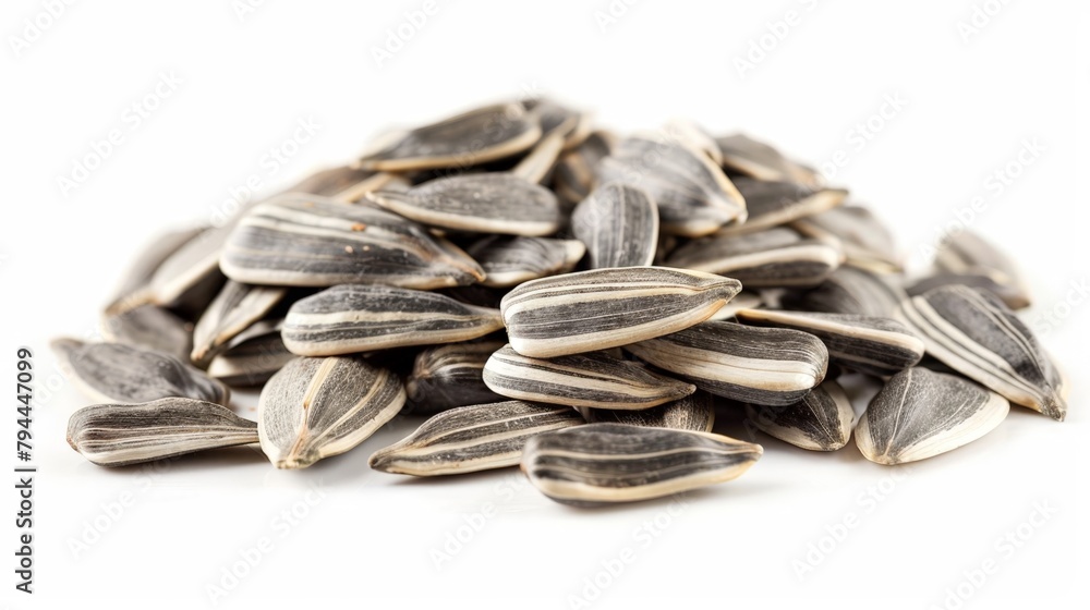 Wall mural Pile of sunflower kernels on white backdrop