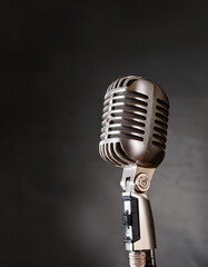 Fototapeta premium A vintage microphone with intricate design, against a dark background