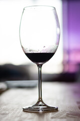 Silhouette of a glass with some red wine.