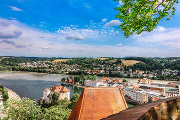 Panoramic view of Passau. Aerial skyline of old town from Veste Oberhaus castle . Confluence of...