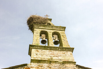 bell tower with a stork nest