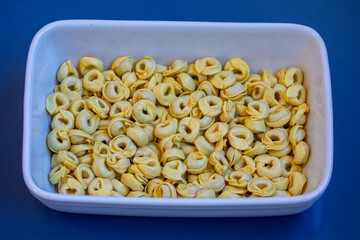 Tortellini or capeletti, isolated, in selective focus and fine details