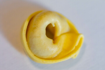Tortellini or capeletti, isolated, in selective focus and fine details