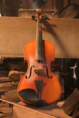 a violin with a rustic background