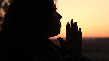 girl woman praying at sunset, hand sunset faith pain, asking heaven for help, girl sunset...