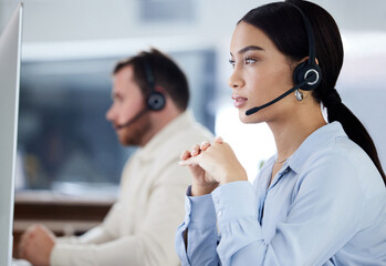 Headset, listening and woman for customer service in office, workspace and job working in call...