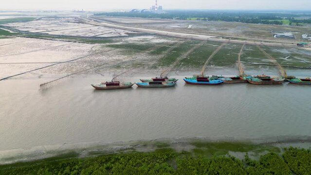 Aerial view of drazer machine and troller boat in the river 