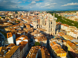 View from drone of impressive Burgos Gothic Cathedral on background of cityscape in summer day, Spain