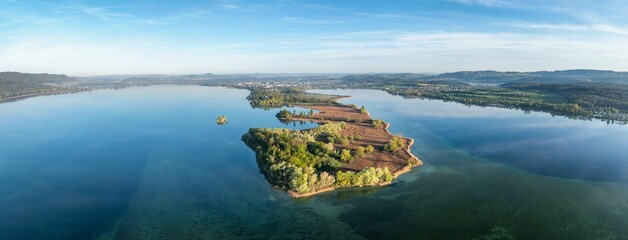 Aerial view, panorama of the Mettnau peninsula with spring-like vegetation, on the horizon the town of Radolfzell on Lake Constance, behind it the Hegau mountains, district of Constance