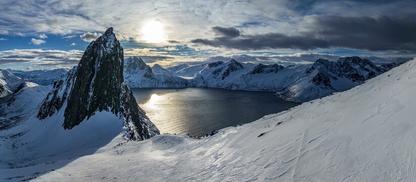 Aerial view of Bergen by the sea, fjord, sunbeams, winter, snow, panorama, Mount Segla, Senja, Troms, Norway, Europe