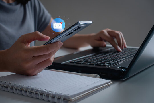Email marketing and Online communication concept. Hand of businesswoman using smartphone for 1 new email with notification alert, reading electronic mail on mobile phone, receive new e-mail message.