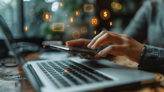 Close up of a woman's hands using a mobile phone and laptop with money icons floating on the screen, in the style of a digital marketing concept