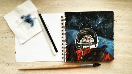 Hand drawn watercolor sketch of astronaut lost in open space. Aquarelle drawing of cosmonaut in cosmos. Sketchbook with illustration of spaceman. Film grain texture. Soft focus. Blur
