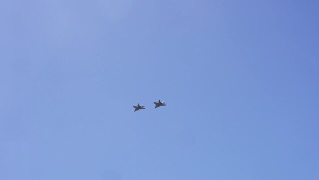 Close up of two F-35 Fighter Jets flying above San Francisco bay in California. The F-35 Lightning II was developed by Lockheed Martin.