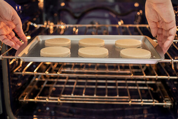 Putting cooking in the oven to bake