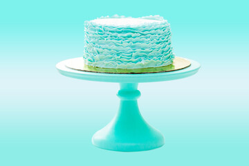 Green elegant birthday cake with fondant ruffles isolated on backgrund with copy space for text