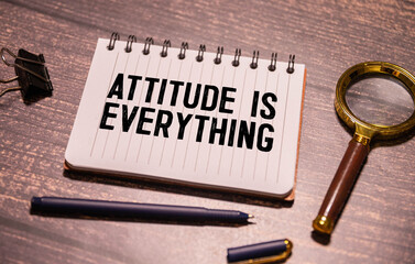 Attitude Is Everything text torn from boxes of paper