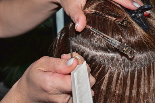 Hot hair extensions on microcapsules. Italian hair extension technology.