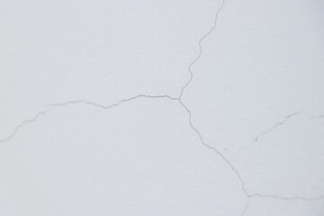 Small cracks on the white wall