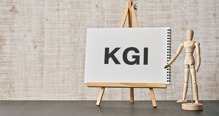 There is notebook with the word KGI. It is an abbreviation for Key Goal Indicator as eye-catching image.