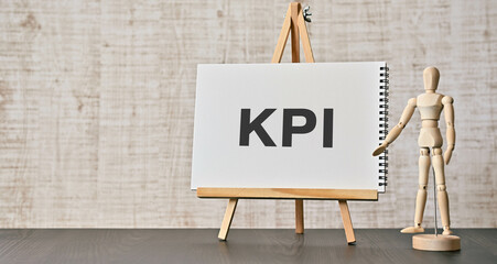 There is notebook with the word KPI. It is an abbreviation for Key Performance Indicator as eye-catching image.