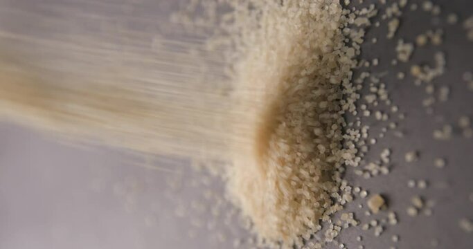 Brown sugar pouring slow motion in studio 4K pro res vertical