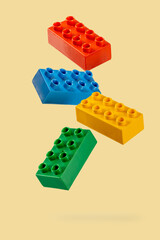 Building toy blocks on yellow background. - 794545418