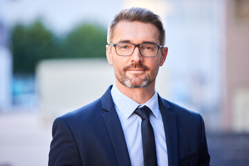 Portrait, mature man and realtor in corporate with face in city as real, estate and agent for company in Berlin. Male person, professional and manager in property for clients in Germany for viewing