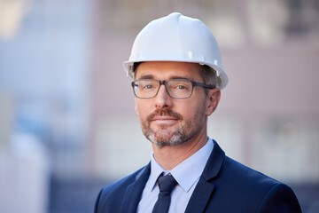 Portrait, businessman and engineer with suit in city as project manager in construction in Berlin....