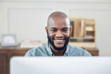 Black man, smile and freelance at computer in home office for business, admin and copywriting at desk. African person, pleased and working in house or apartment for task, planning or networking at PC