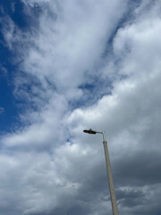 Lamppost with clouds and blue sky