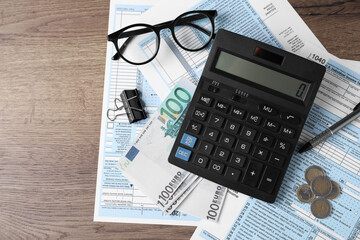 Tax accounting. Flat lay composition with calculator and documents on wooden table, space for text