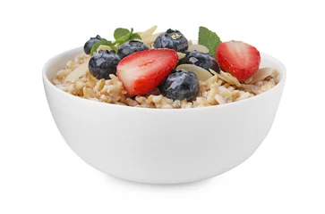 Fotobehang Tasty oatmeal with strawberries, blueberries and almond flakes in bowl isolated on white © New Africa