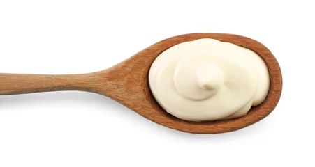 Keuken spatwand met foto Natural yogurt in wooden spoon isolated on white, top view © New Africa