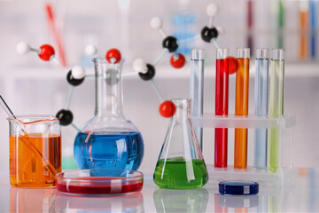 Different glassware and molecule model in laboratory