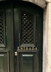 the allure of Portugal with this vintage emerald green door, a symbol of the country's rich architectural heritage and timeless charm