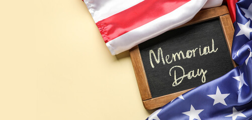 Chalkboard with text MEMORIAL DAY and USA flag on light background