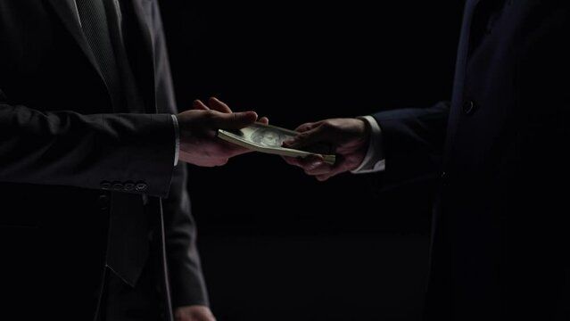 Illegal transfer of money and bribery in close-up, the concept of crime