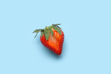Fresh strawberry on blue background. Sex education - obrazy, fototapety, plakaty