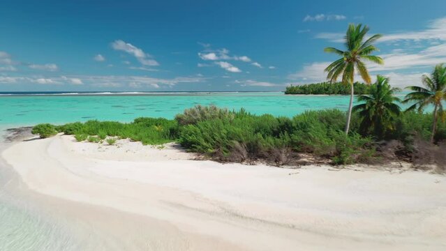Tourist female in bikini waving hands relax small tropical island beach. Wild untouched nature, coral reef sea landscape, crystal water, palm trees. Travel summer holiday vacation. Aerial drone flight