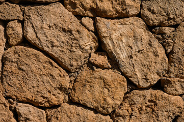 grey stone dark wall of medieval horizontal stones facade background 3