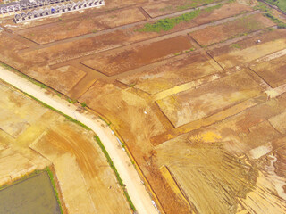 Land leveled for public houses. Aerial drone view of Housing development on the edge of the city....